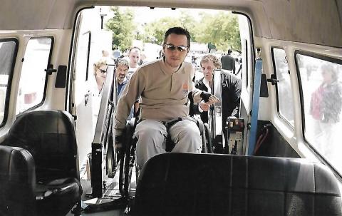 photo of a young man who is a wheelchair user and he is on a van the photo was taken in 2005